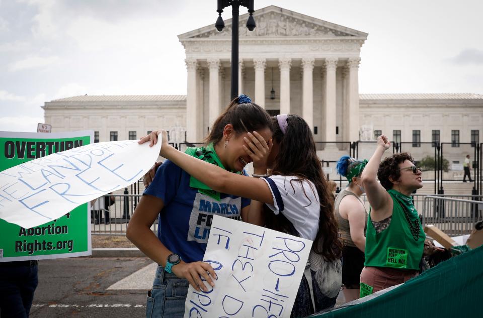 Anti-abortion activists react to the Dobbs v Jackson Women’s Health Organization ruling which overturns the landmark abortion Roe v. Wade case in front of the U.S. Supreme Court on June 24, 2022, in Washington, DC.