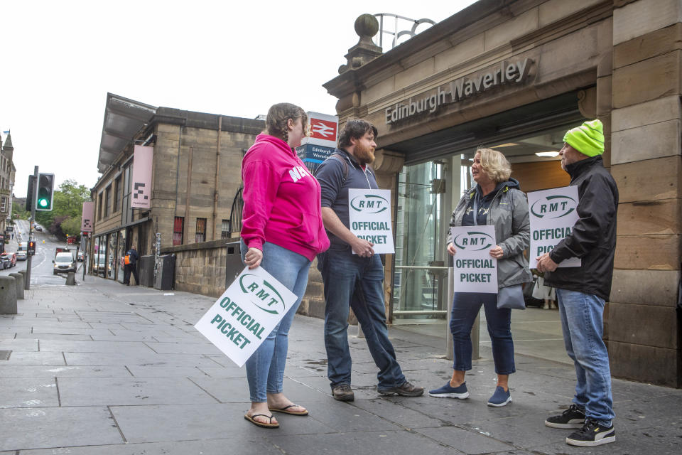 RMT picket line outside Waverley Train Station in Edinburgh during morning rush hour as day one of UK wide three-day rail strike begins. (SWNS)