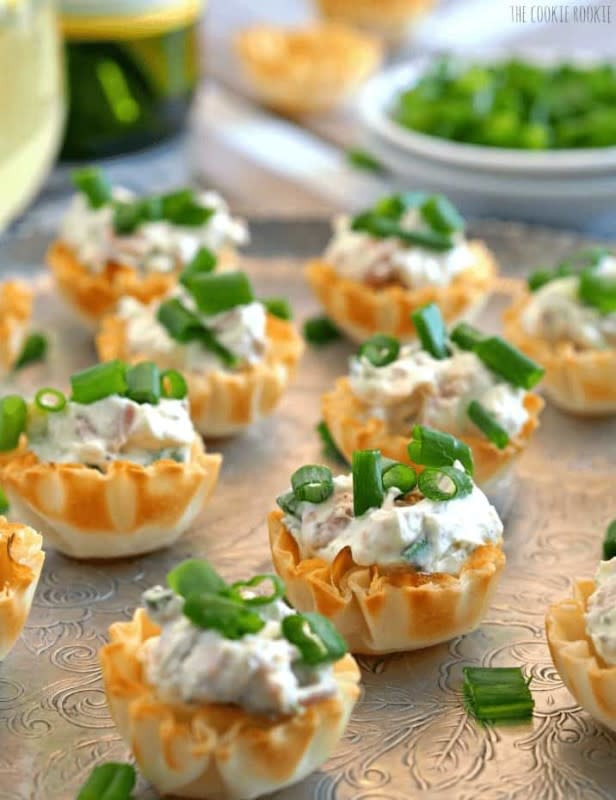 <p>The Cookie Rookie</p><p>These boursin prosciutto phyllo cups are the perfect appetizer for when you don’t want to turn on the oven. So pop-able! Creamy Boursin is mixed with salty prosciutto in these delicious and easy appetizer treats!</p><p><strong>Get the recipe: <a href="https://www.thecookierookie.com/boursin-prosciutto-phyllo-cups/" rel="nofollow noopener" target="_blank" data-ylk="slk:Boursin Prosciutto Phyllo Cups;elm:context_link;itc:0;sec:content-canvas" class="link rapid-noclick-resp"><em>Boursin Prosciutto Phyllo Cups</em></a></strong></p>