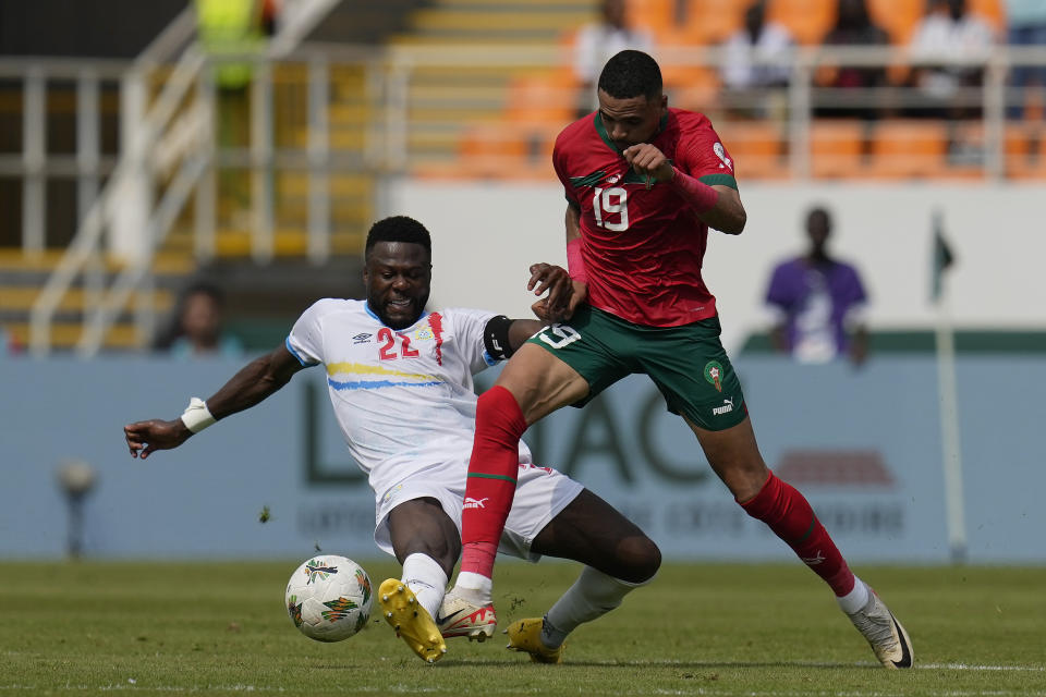 DR Congo's Chancel Mbemba, left, and Morocco's Youssef En-Nesyri challenge for the ball during the African Cup of Nations Group F soccer match between Morocco and DR Congo, at the Laurent Pokou stadium in San Pedro, Ivory Coast, Sunday, Jan. 21, 2024. (AP Photo/Themba Hadebe)