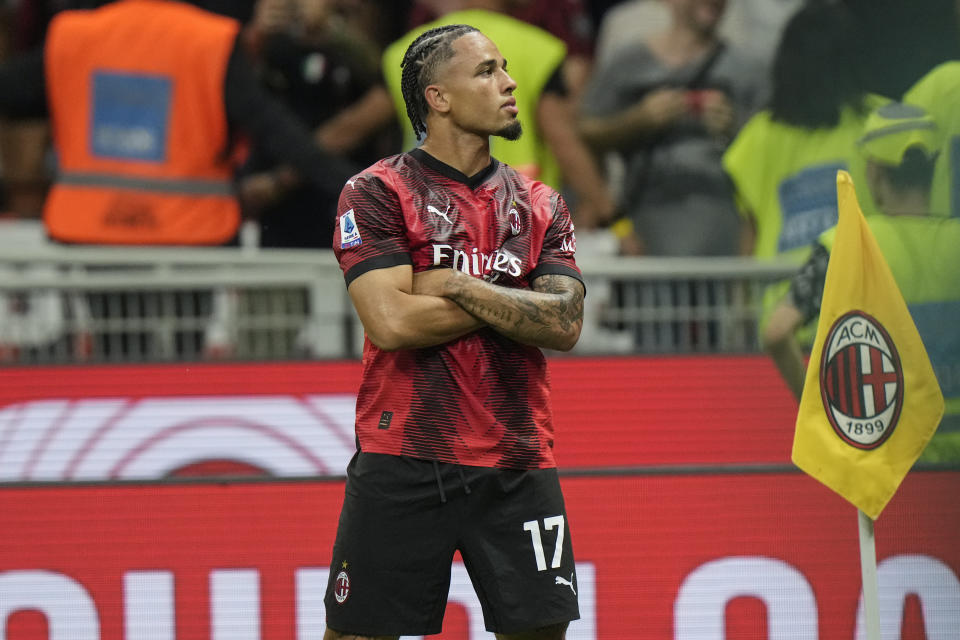 AC Milan's Noah Okafor celebrates scoring his side's second goal during a Serie A soccer match between AC Milan and Lazio, at the San Siro stadium in Milan, Italy, Saturday, Sept. 30, 2023. (AP Photo/Luca Bruno)