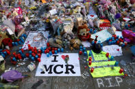 Flowers, messages and tokens are left in tribute to the victims of the attact on Manchester Arena, in central Manchester, Britain May 26, 2017. REUTERS/Stefan Wermuth