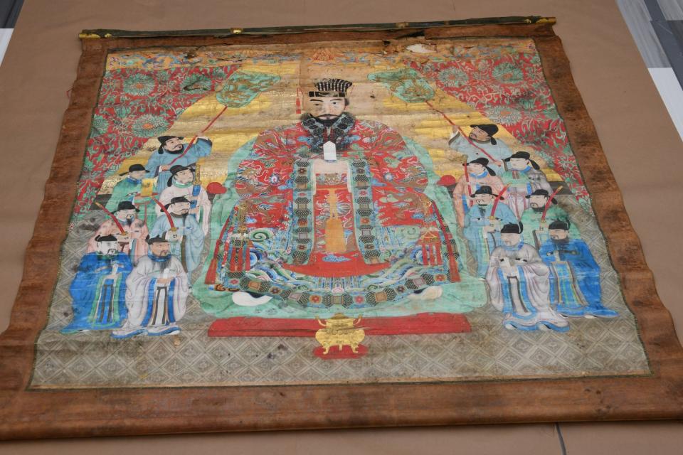 Pictured is one  of six painted scrolls from the 18th-19th centuries. The artifacts were taken to the Smithsonian Institution's National Museum of Asian Art in Washington, D.C., where the scrolls were unfurled for the first time in many years, revealing portraits of Okinawan royalty in vivid reds, golds, and blue accents.