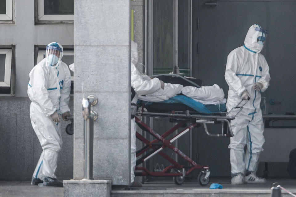 Image: Medical staff members carry a patient into the Jinyintan hospital, where patients infected by a mysterious SARS-like virus are being treated, in Wuhan in China's central Hubei province (AFP - Getty Images file)