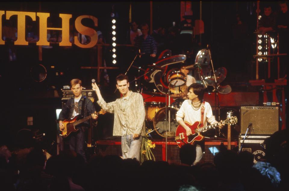 UNITED KINGDOM - MARCH 16:  Photo of Andy ROURKE and MORRISSEY and Mike JOYCE and Johnny MARR and SMITHS; L-R: Andy Rourke, Morrissey, Mike Joyce (drums), Johnny Marr (playing Gibson ES-335 guitar), performing live on The Tube - MusicBrainz: 40f5d9e4-2de7-4f2d-ad41-e31a9a9fea27  (Photo by Pete Cronin/Redferns)