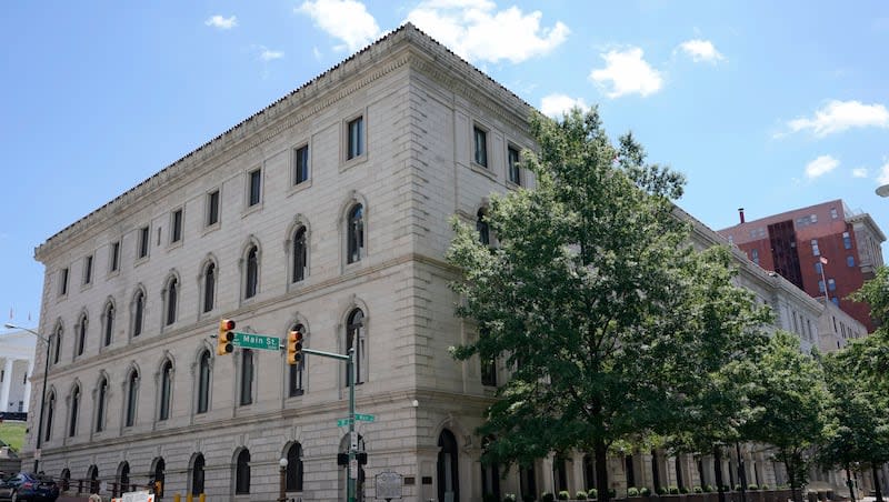 A pedestrian passes by the US 4th Circuit Court of Appeals Courthouse on Main Street in Richmond, Va., Wednesday, June 16, 2021.