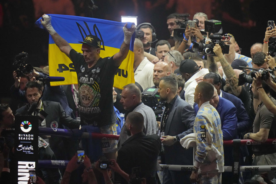 Ukraine's Oleksandr Usyk celebrates after beating Britain's Tyson Fury in their undisputed heavyweight world championship boxing fight at the Kingdom Arena in Riyadh, Saudi Arabia, Sunday, May 19, 2024. (AP Photo/Francisco Seco)