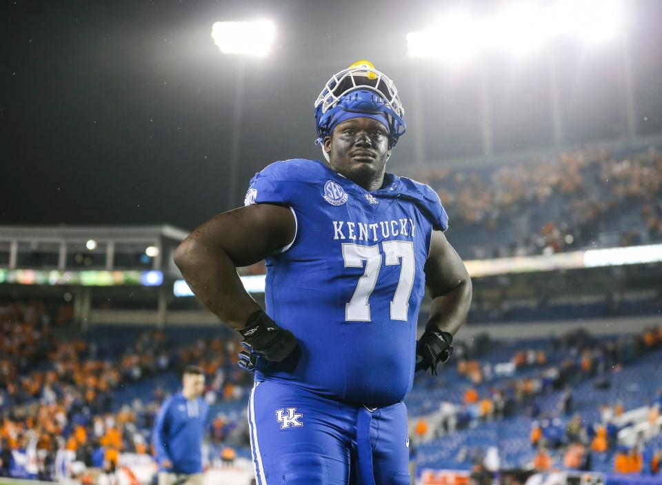 Kentucky Wildcats offensive lineman Jeremy Flax (77) looks up at the stands as he walks off the field after the Cats fall to Tennessee 33-27 Saturday night in Lexington. Kentucky is now 5-3 for the season. Oct. 28, 2023.