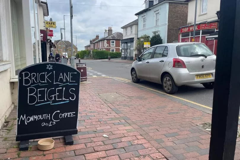 A Monmouth coffee for only £3 - that's a nice deal, and lovely Brick Lane Beigels - an A-board sign on the red brick pavement saying about the coffee and beigels