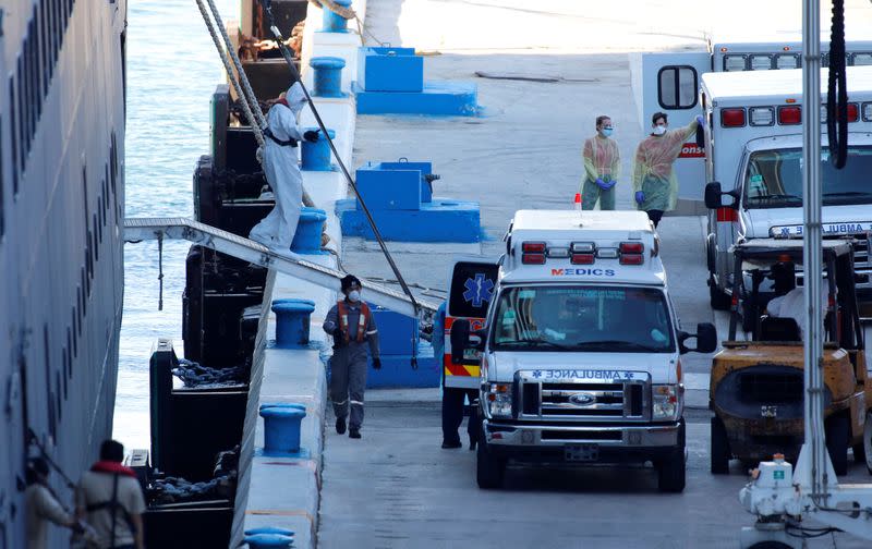 Rescue workers stand by the Zaandam of the Holland America Line cruise ship, afflicted with coronavirus disease (COVID-19), at Port Everglades in Fort Lauderdale, Florida