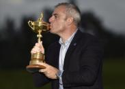 Captain Paul McGinley kisses the Ryder Cup after the closing ceremony of the 40th Ryder Cup at Gleneagles in Scotland September 28, 2014. REUTERS/Toby Melville