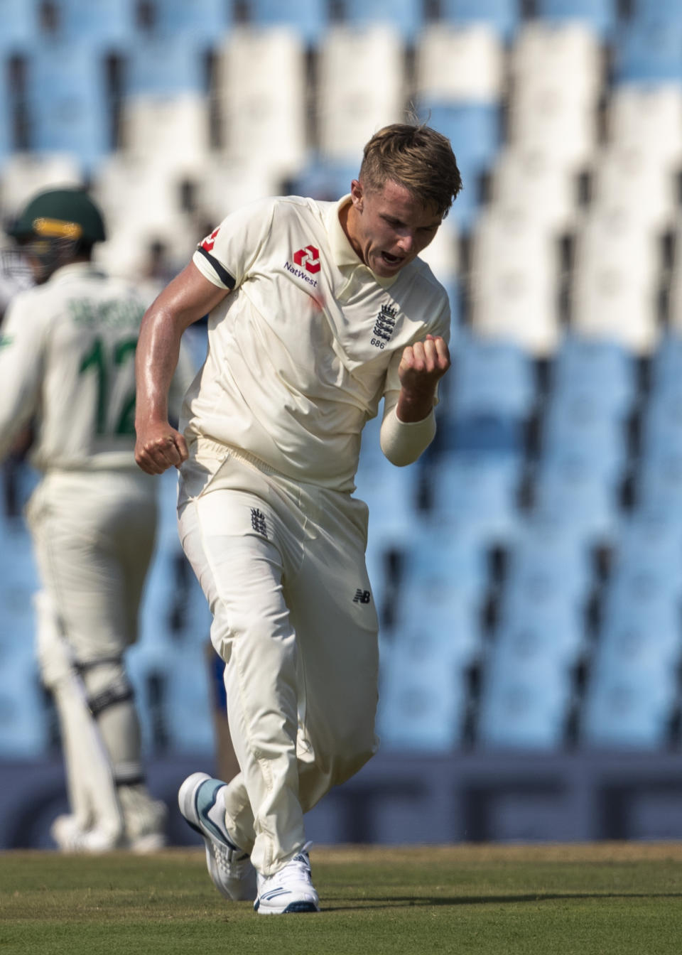 England's bowler Sam Curran reacts after dismissing South Africa's batsman Dwaine Pretorius for 33 runs on day one of the first cricket test match between South Africa and England at Centurion Park, Pretoria, South Africa, Thursday, Dec. 26, 2019. (AP Photo/Themba Hadebe)