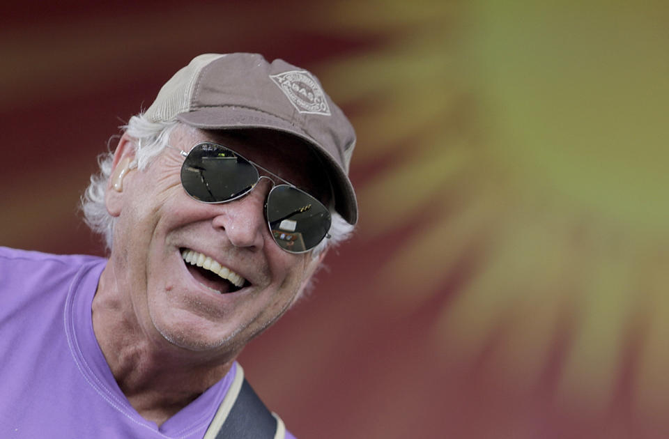 FILE - Jimmy Buffett performs on the Acura Stage during the New Orleans Jazz and Heritage Festival at the Fairgrounds in New Orleans Sunday, April 26, 2015. Buffett, who popularized beach bum soft rock with the escapist Caribbean-flavored song “Margaritaville” and turned that celebration of loafing into an empire of restaurants, resorts and frozen concoctions, has died, Friday, Sept. 1, 2023. (Brett Duke /The Times-Picayune/The New Orleans Advocate via AP)