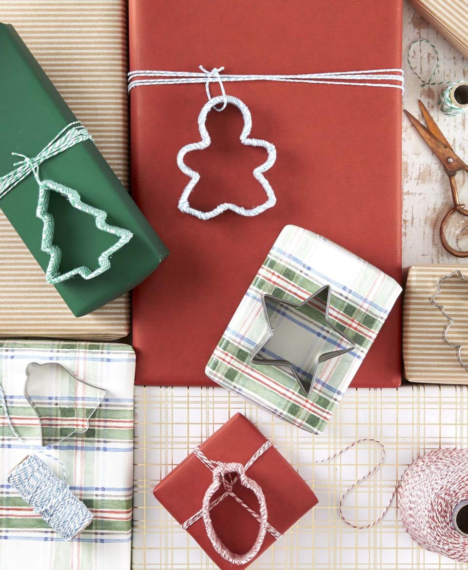 cookie cutters wrapped in twine use to decorate wrapped presents