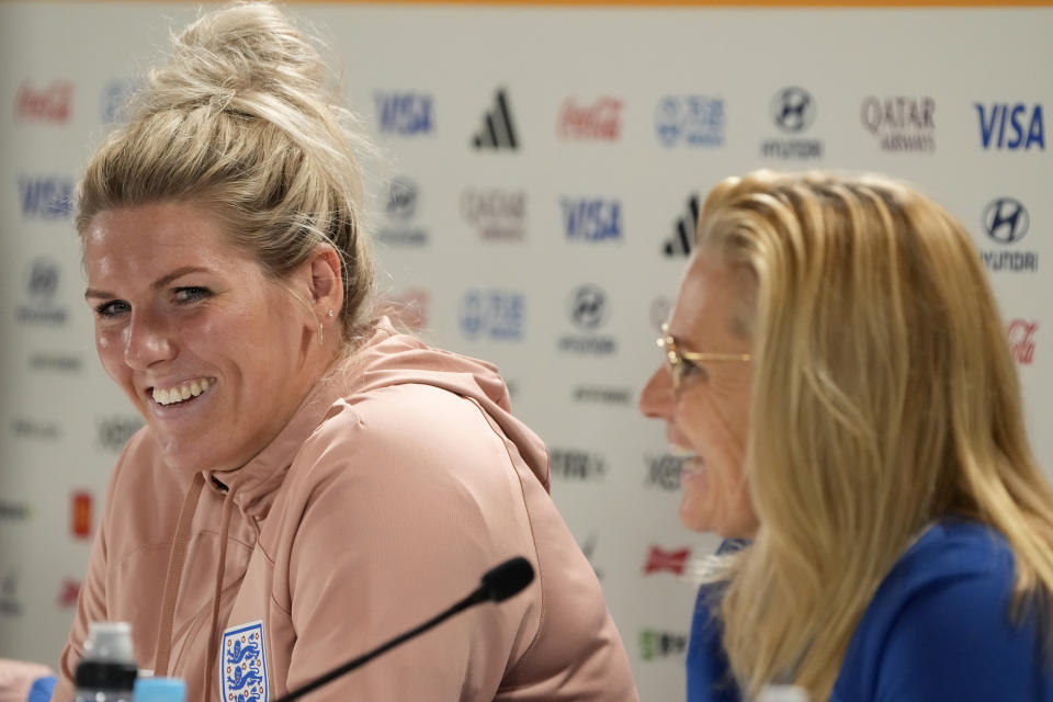 England's Millie Bright, left, and England's head coach Sarina Wiegman attend a press conference ahead of their Women's World Cup semifinal soccer match against Australia at Stadium Australia in Sydney, Australia, Tuesday, Aug. 15, 2023. Their semifinal is scheduled for Wednesday. (AP Photo/Rick Rycroft)