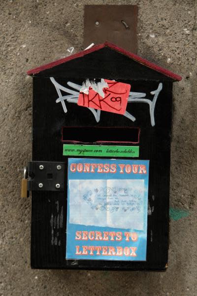 A confession box on the street is fixed on a wall in Temple Bar in Dublin.