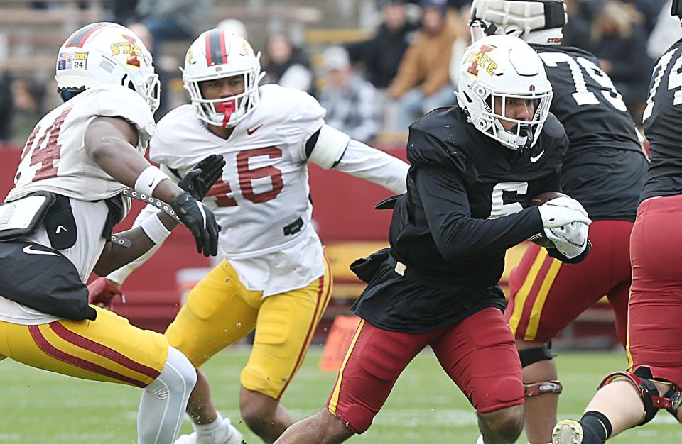 Carston Marshall, center, has narrowed his choices to three schools after entering the transfer portal from Iowa State.