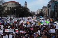 Participants hold up signs as students and gun control advocates hold the "March for Our Lives" event demanding gun control after recent school shootings at a rally in Washington, U.S., March 24, 2018. REUTERS/Jonathan Ernst