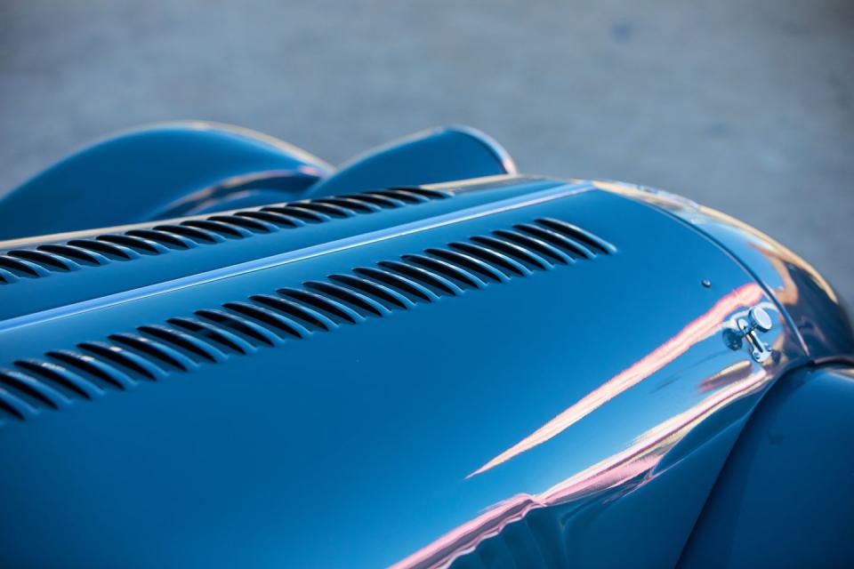 <p>The Ford 2.0-liter inline-four sits far forward under the two-piece hood because the footwells extend out under the hood, too. All cars should have an exhaust header this pretty.</p>