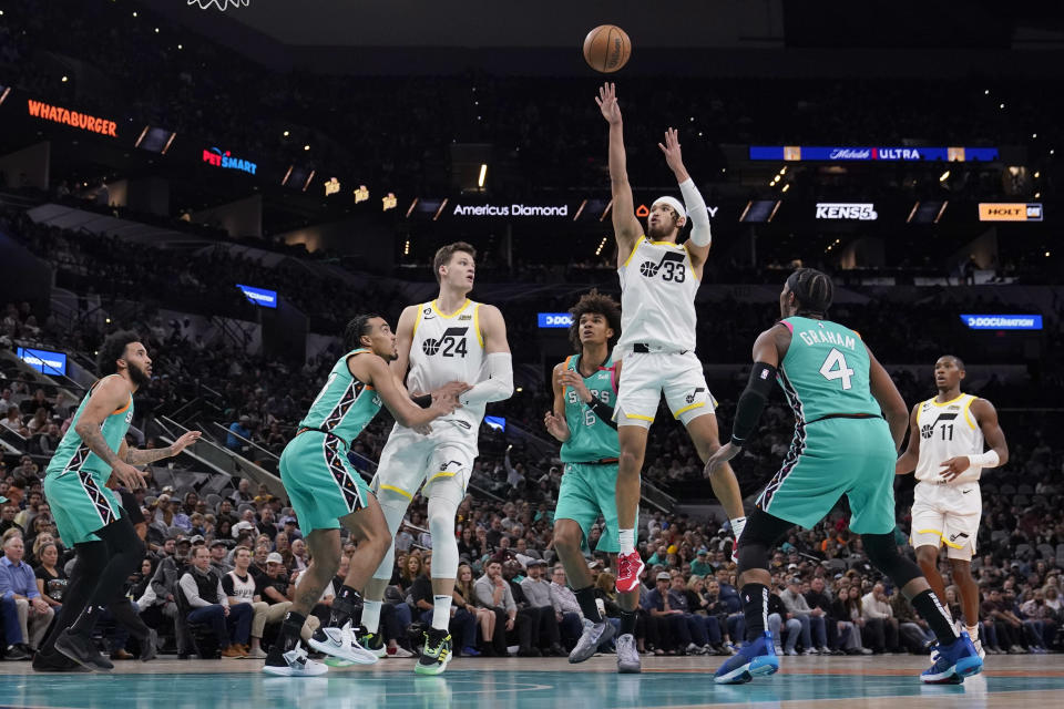 Utah Jazz guard Johnny Juzang (33) shoots against the San Antonio Spurs during the second half of an NBA basketball game in San Antonio, Wednesday, March 29, 2023. (AP Photo/Eric Gay)