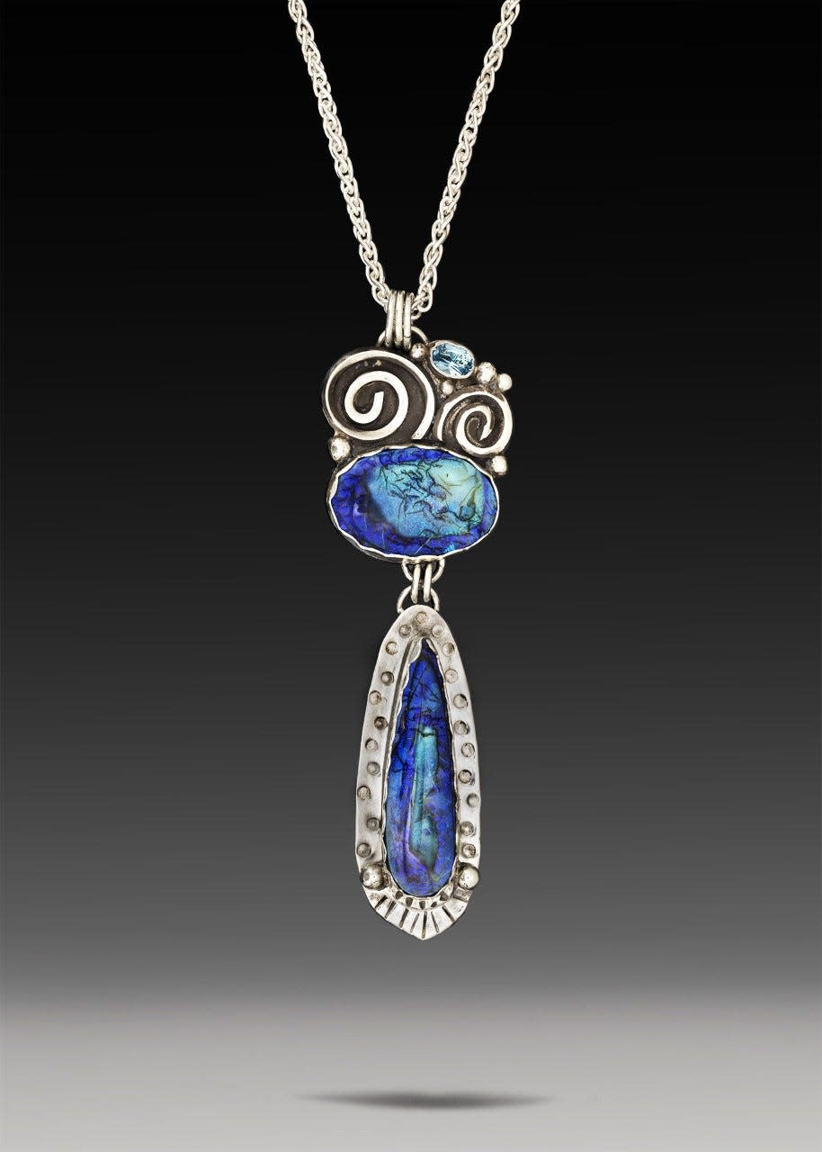 A necklace created with sterling opal and sky blue topaz by Mary Lou Christie.