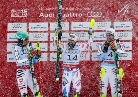 Feb 15, 2015; Beaver Creek, CO, USA; Race winner Jean-Baptiste Grange of France (middle) celebrates on the podium next to Felix Neureuther of Germany (left) and Fritz Dopfer of Germany (right) after run two of the men's slalom in the FIS alpine skiing world championships at Birds of Prey Racecourse. Mandatory Credit: Jeff Swinger-USA TODAY Sports