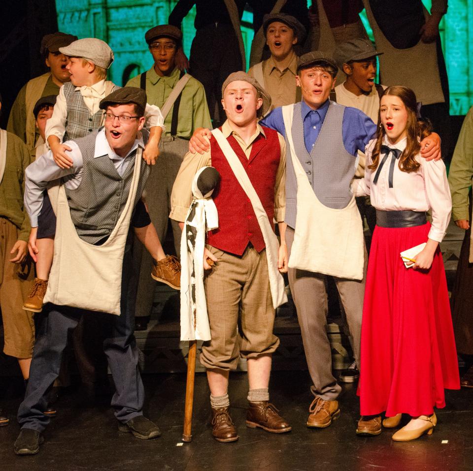Davey (Cole Castle) and Les (Andrew Horning), Crutchie (Zach Kinser), Jack (Robby Ritchie) and Katherine (Alex Ritchie) celebrate their victory in their battle over newspaper prices during this scene from Carnation City Players' production of "Newsies Jr."