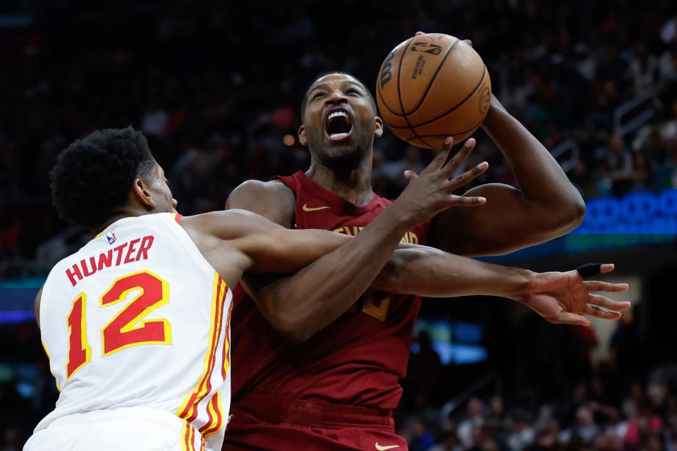 Cleveland Cavaliers center Tristan Thompson, right, is fouled by Atlanta Hawks forward De'Andre Hunter (12) on Dec. 16, 2023, in Cleveland.