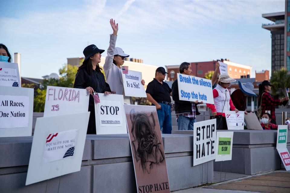 Dozens gather in front of the Capitol to voice their opposition to SB264 and HB1355 on Wednesday, April 19, 2023. The bills state that Chinese people would not be allowed to purchase homes in Florida. 