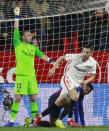 Sevilla's Pablo Sarabia, right, celebrates after scoring during a Spanish Copa del Rey soccer match between Sevilla and FC Barcelona in Seville, Spain, Wednesday Jan. 23, 2019. (AP Photo/Miguel Morenatti)