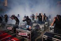 Entertainment workers gather in Piazza del Popolo Square to protest against the Italian government's economic policies to combat the spread of COVID-19 and to demand to reopen their business, in Rome, Saturday, April 17, 2021. (AP Photo/Andrew Medichini)