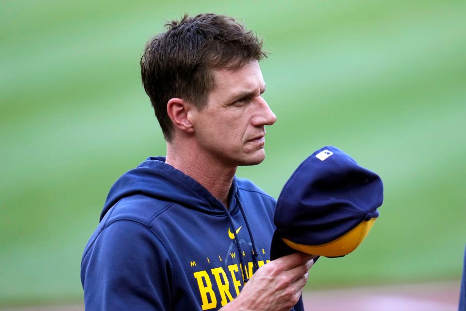 Milwaukee Brewers manager Craig Counsell returns to the dugout after the national anthem before a baseball game against the Pittsburgh Pirates in Pittsburgh, Friday, June 30, 2023.