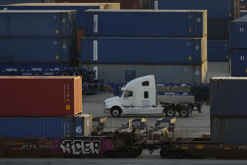 FILE - A truck drives past containers inside PortMiami on Dec. 16, 2021, in Miami. For your average Floridian, cost of living concerns have become an issue and really are not being addressed as vocally as most folks would have hoped. Inflation has played a role, but a lot of the discussion has been steered away from those issues that affect everyday Floridians to more of an “us against them” on cultural issues or issues like abortion, and discussions of race. (AP Photo/Rebecca Blackwell, File)