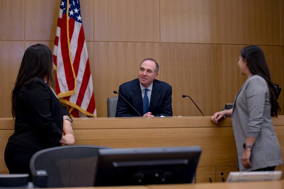 New U.S. District Court Judge Leon Schydlower sits at the Albert Armendariz Sr. Federal Courthouse on Wednesday, March 27, 2024, as he talks with courtroom deputies Veronica Medina and Erika Portillo. Schydlower reflected on his latest public service journey: "It's not often that someone hears that the president of the United States is going to nominate them for a lifetime position."