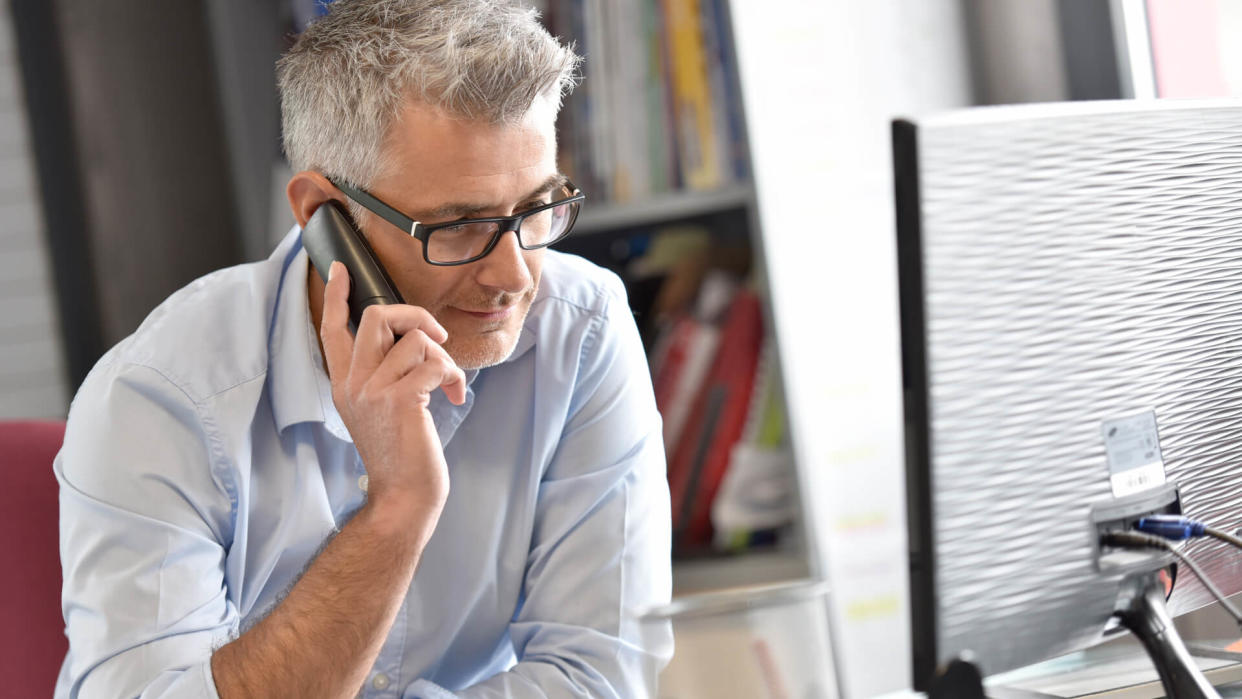 businessman-office-talking-on-phone