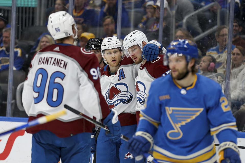 Colorado Avalanche's Valeri Nichushkin , second from right, is congratulated by teammates after scoring against the St. Louis Blues during the third period of an NHL hockey game Saturday, Feb. 18, 2023, in St. Louis. (AP Photo/Scott Kane)