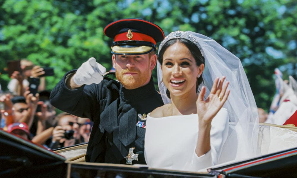 Prince Harry and Meghan Markle during the procession after getting married in Windsor, England.