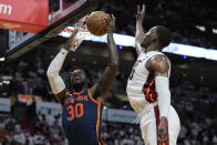New York Knicks forward Julius Randle (30) goes up for a shot against Miami Heat center Bam Adebayo (13) during the first half of Game 3 of an NBA basketball second-round playoff series, Saturday, May 6, 2023, in Miami. (AP Photo/Wilfredo Lee)