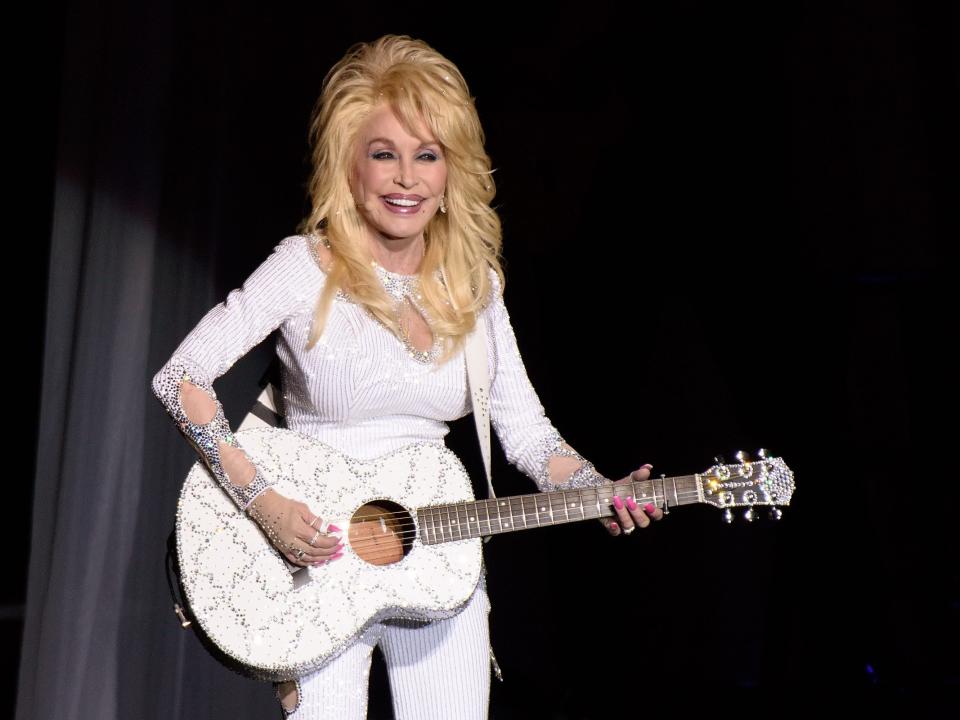 Dolly Parton performs during the Pure & Simple tour in 2016.