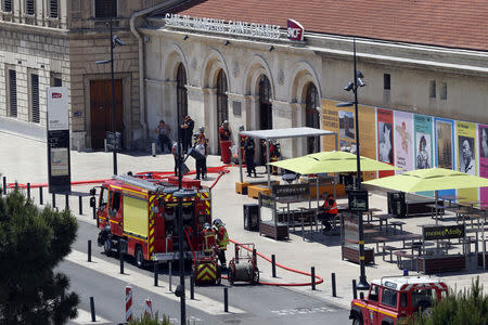 French fire brigade and police are seen outside the Gare Saint Charles train station which was evacuated after an alert in Marseille, France, May 19, 2018. REUTERS/Philippe Laurenson