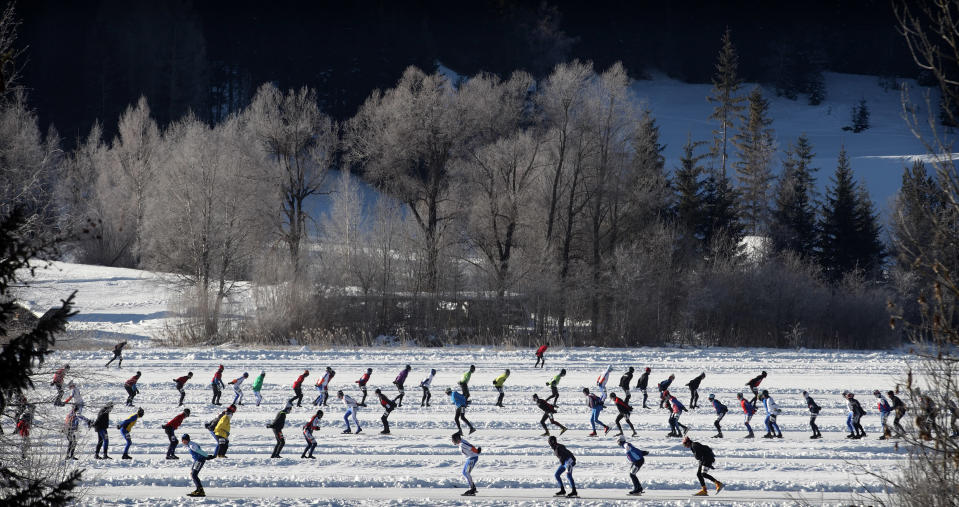 Skaters, out of some 1100 athletes, compete in the 200 km (124 miles) race in Techendorf in Austria's southern Carinthia province, January 27, 2012. Techendorf hosts the Alternatieve Elfstedentocht Weissensee (Alternative Eleven City Races Weissensee), a traditional Dutch series of speed skating events for both professionals and amateurs with some 6.000 participants from January 23 to February 4. REUTERS/Heinz-Peter Bader  (AUSTRIA - Tags: SPORT SPEED SKATING SOCIETY TPX IMAGES OF THE DAY)