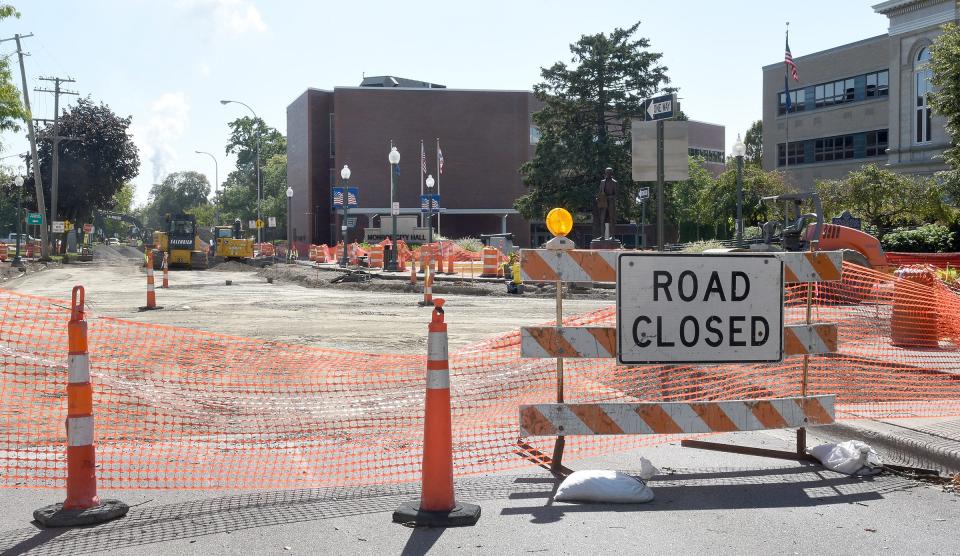 Road closed signs block off construction on 1st and Washington streets in downtown Monroe.