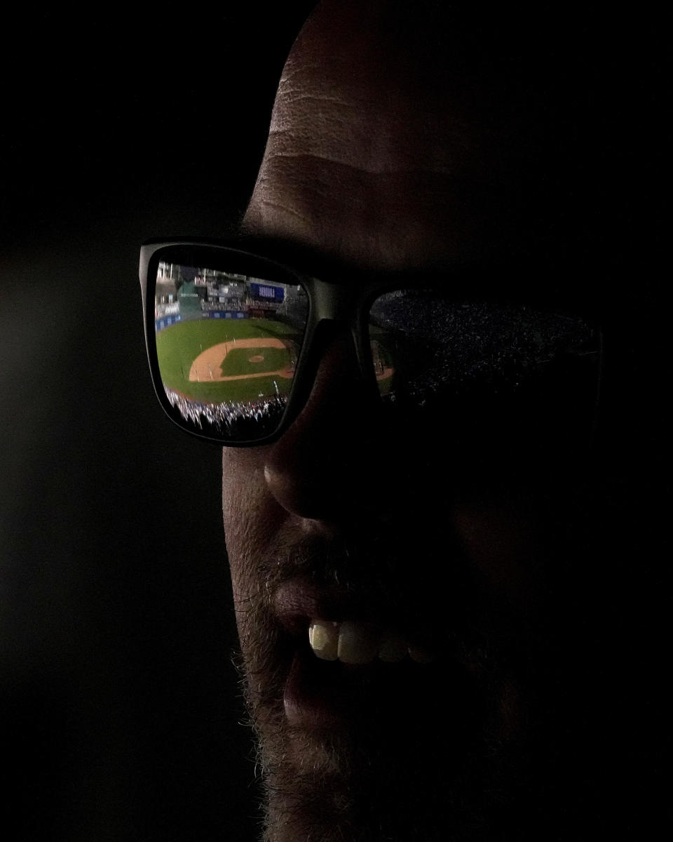 A fan watches during the seventh inning of a baseball game between the Kansas City Royals and the San Diego Padres Saturday, June 1, 2024, in Kansas City, Mo. (AP Photo/Charlie Riedel)