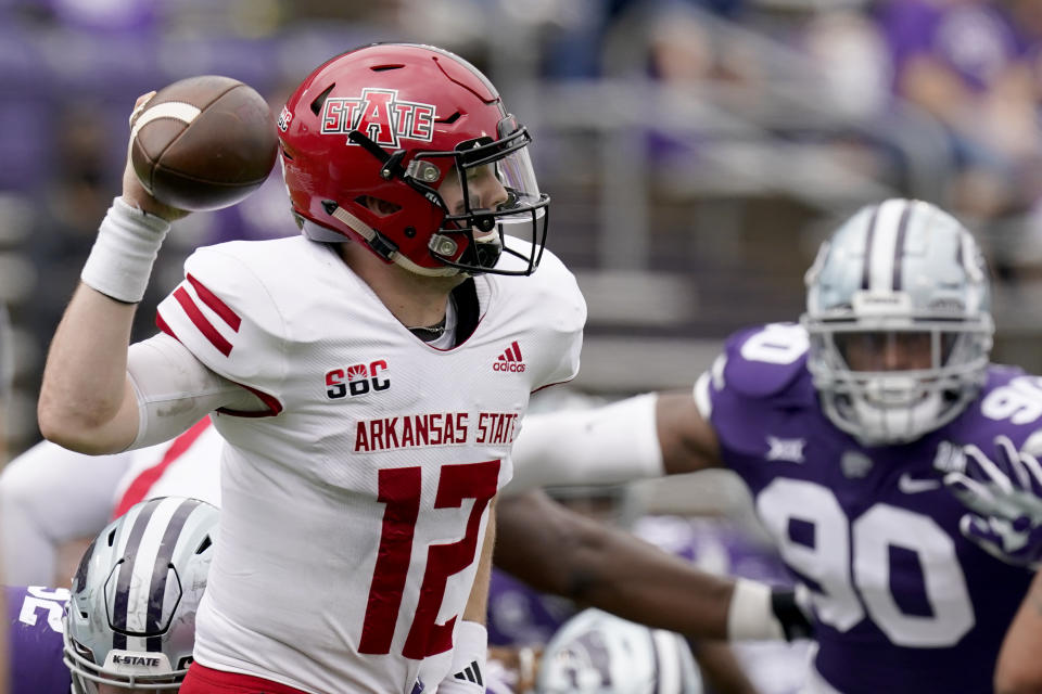 Arkansas State quarterback Logan Bonner throws during the second half of an NCAA college football game against Kansas State, Saturday, Sept. 12, 2020, in Manhattan, Kan. (AP Photo/Charlie Riedel)