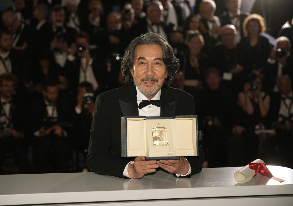 Koji Yakusho, winner of the award for best actor for 'Perfect Days', poses for photographers during a photo call following the awards ceremony at the 76th international film festival, Cannes, southern France, Saturday, May 27, 2023. (AP Photo/Daniel Cole)
