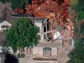 <p>Crews demolish the former home of O.J. Simpson, Wednesday, July 29, 1998, in the Brentwood area of Los Angeles, Calif. (Photo: Mark J. Terrill/AP) </p>