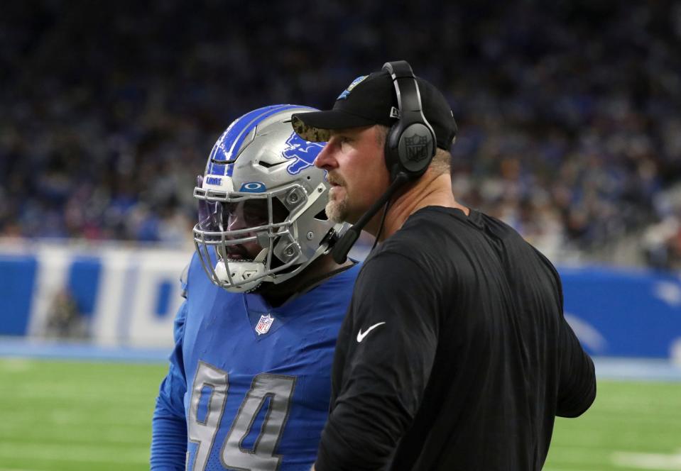 Lions coach Dan Campbell and defensive tackle <a class="link " href="https://sports.yahoo.com/nfl/players/33239" data-i13n="sec:content-canvas;subsec:anchor_text;elm:context_link" data-ylk="slk:Benito Jones;sec:content-canvas;subsec:anchor_text;elm:context_link;itc:0">Benito Jones</a> on the sidelines during the Lions’ 34-23 win over the Vikings on Sunday, Dec. 11, 2022, at Ford Field.<br>Lionsminn 121122 Kd 3945