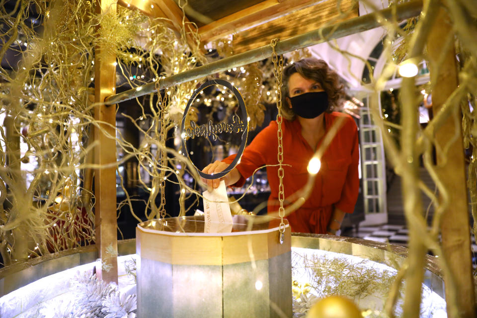 LONDON, ENGLAND - DECEMBER 03: 'Festive Wishes from the Savoy' a brand new golden well of wishes, where visitors can drop in their wishes as part of the new festive charity initiative, part of the Christmas decorations at The Savoy Hotel on December 03, 2020 in London, England.  Making a wish requires a minimum donation of £5 with proceeds being shared equally between two charities, Hospitality Action and The Connection at St Martin in the Fields.
 (Photo by Tim P. Whitby/Getty Images)