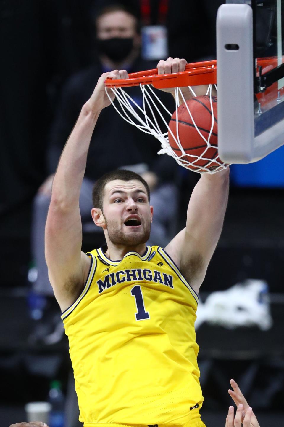 Michigan center Hunter Dickinson dunks the ball during the first half of the Elite Eight of the 2021 tournament on Tuesday, March 30, 2021, in Indianapolis.