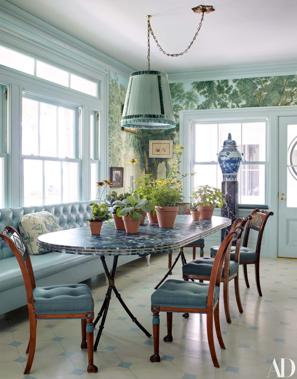 Neoclassical chairs with hand-painted details by Agustin Hurtado surround the breakfast room table.